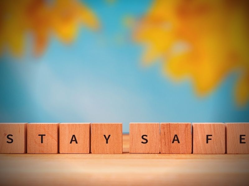 Scrabble letters spelling out the words, "stay safe."
