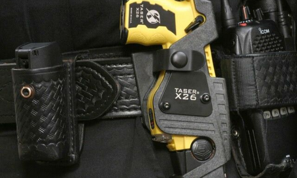 A few self-defense weapons strapped to a belt.