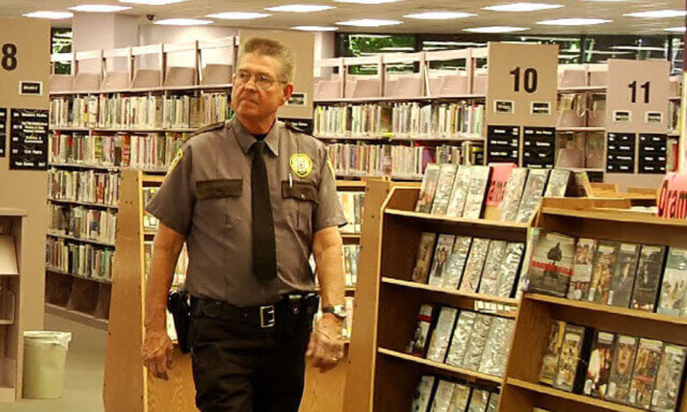 A security guard roaming around a campus bookstore.