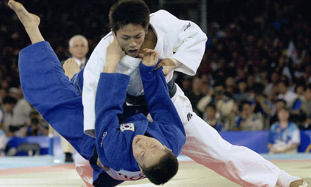A judo throw, one of the hardest martial arts moves to pull off for beginners.