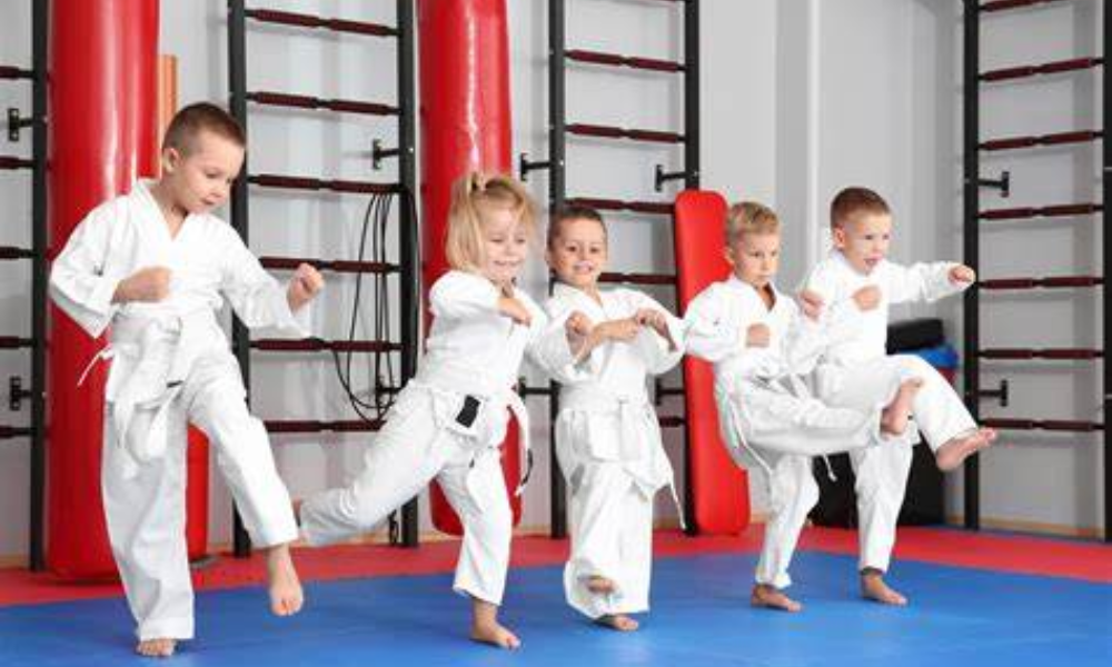 Children happily training martial arts.