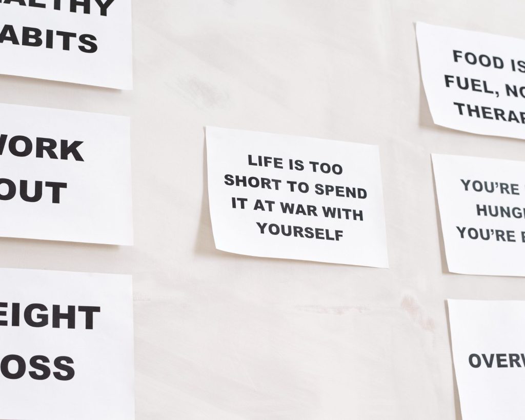 A list of healthy habits taped to a wall.