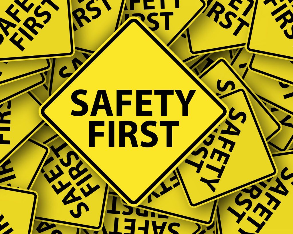 a group of signs to remind people that safety should always come first