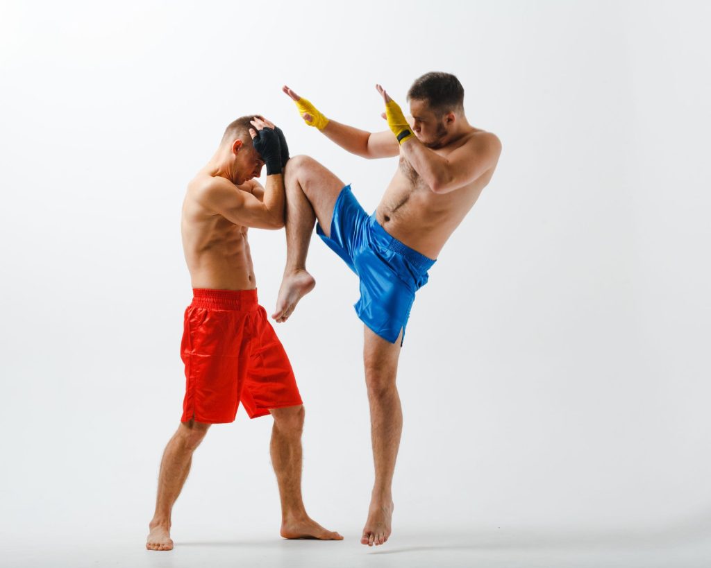 Two men practicing their martial arts.
