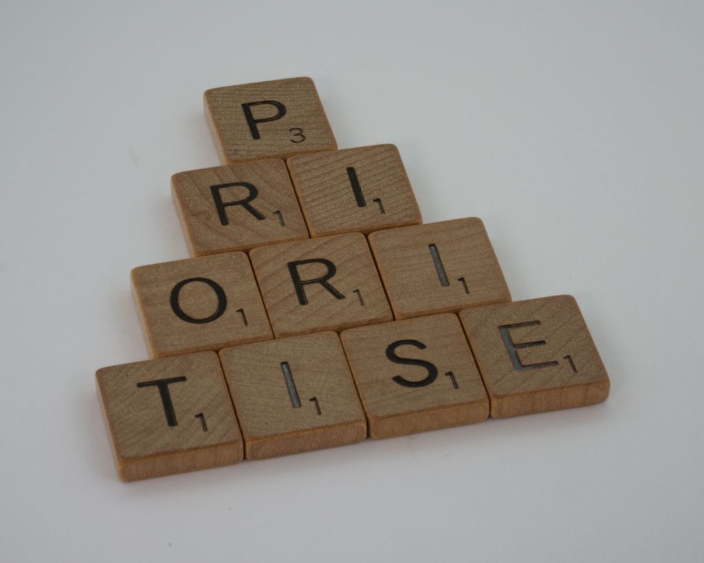 Scrabble letters spelling out the word, "PRIORITISE," showing how tai chi should ideally be a part of someone's life.