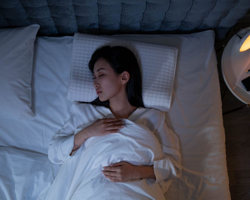 A woman enjoying a good night's sleep.